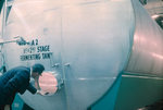 Man looking into a 1st and 2nd Stage Fermenting Tank, Carling Brewery