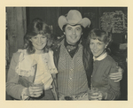 Cowboy with two women
