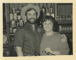 Couple next to Drink Shelf