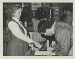 Man signing a reservation