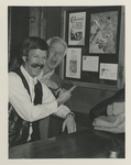 Joe Dulle and Elder Man pointing at Drawing