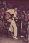 Band member playing Guitar