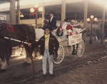 Cowgirl next to Stockyards Santa's Express Wagon
