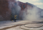 Fire fighters wearing gas masks