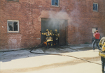 Fire fighters entering the Stockyards Mule Barn