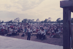 People sitting on bales of hay