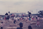 People sitting at the Texas Sesquicentennial Wagon Train