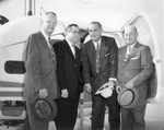 Lyndon B. Johnson and others beside helicopter