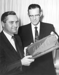 Ben Carpenter holding plaque