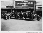 Two new fire trucks for the Arlington Fire Department; several men standing on and beside the new trucks [names on back of photo], Texas