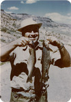 Color photographs of Amon G. Carter, Jr. on a fishing trip