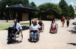 Jim Hayes (in front) with others on University of Texas at Arlington (U. T. A.) walkway