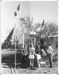 University of Texas at Arlington (U. T. A.) "Rebel Headquarters" shack with students standing by entrance