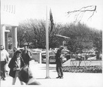 Non-student protester raising Confederate flag by Student Center, University of Texas at Arlington (U. T. A.)