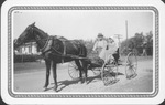 "Granddad and Grandmother Brister" in horse drawn buggy, Burleson, Texas