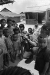 Associated Press photographer Eddie Adams with Vietnamese children by Bob Schieffer