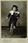 Cabinet card of Freddie Raymond Schmidt on tricycle, age 3-1/2 by C. L. Swartz