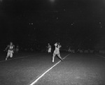 Nighttime college football game by Squire Haskins Photography Inc.