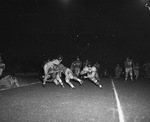 Nighttime college football game by Squire Haskins Photography Inc.