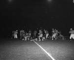 Nighttime college football game by Squire Haskins Photography Inc.