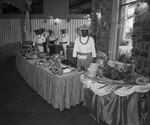 Five black men stand behind buffet tables by Squire Haskins Photography Inc.