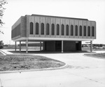 Small raised office building with parking underneath. Dallas Board Realtors new office on Stemmons Freeway. by Squire Haskins Photography Inc.