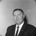 Photograph of a man in a business suit by Squire Haskins Photography Inc.