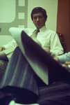 Young businessman seated wearing a tie and dress shirt by Squire Haskins Photography Inc.