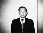 Photograph of a man wearing a suit and tie by Squire Haskins Photography Inc.