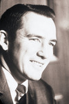 Bust photograph of a man wearing a jacket and tie by Squire Haskins Photography Inc.