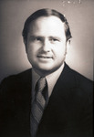 Bust photograph of a man wearing a jacket and tie by Squire Haskins Photography Inc.