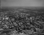 Aerial view of downtown Dallas, Texas. A banner pulled by a bi-plane by Squire Haskins Photography Inc.