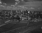 Downtown Dallas, Texas with electrical power plant in the foreground by Squire Haskins Photography Inc.