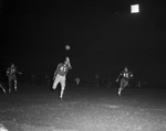 Football game, nighttime by Squire Haskins Photography Inc.