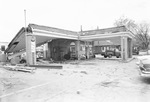 Gas station, possibly hit and damaged by a vehicle by Squire Haskins Photography Inc.