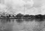 Fair Park, Dallas. The Lagoon is in the foreground with the Midway and Cotton Bowl in the background by Squire Haskins Photography Inc.