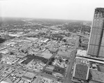 Construction of the Southland Life complex. Dallas High School is directly behind the construction site with Central Expressway leading out of downtown by Squire Haskins Photography Inc.