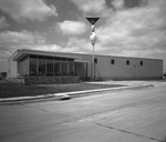 Building topped with an AMF sign by Squire Haskins Photography Inc.