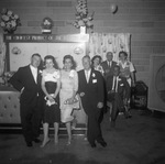 Individuals in evening attire attend an event by Squire Haskins Photography Inc.