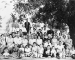 Photograph of a large group of people, possibly a family reunion by Squire Haskins Photography Inc.