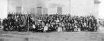 Group of people standing in front of possibly a church or synagogue by Squire Haskins Photography Inc.