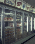 Refrigerated cases containing a large selection of beer by Squire Haskins Photography Inc.