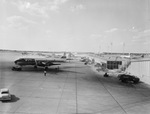 Exterior, Dallas Love Field. A terminal and parked plans on a tarmac are visible by Squire Haskins Photography Inc.