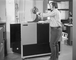 Man operating a Saxon CD 7500 machine by Squire Haskins Photography Inc.