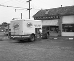 Smith's Ice Cream driver is making a delivery to Cates Pharmacy by Squire Haskins Photography Inc.