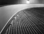 Floor under construction. Part of the floor is covered with what look like electrical coils by Squire Haskins Photography Inc.