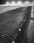 Floor under construction. Part of the floor is covered with what look like electrical coils by Squire Haskins Photography Inc.