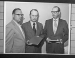 Group of three men, unknown, holding copies of the Dallas Area Diet Manual, 1972 by Squire Haskins Photography Inc.