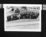 Group of men posing on a hillside by Squire Haskins Photography Inc.