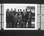 Group of men posing in front of a reflecting ppol by Squire Haskins Photography Inc.